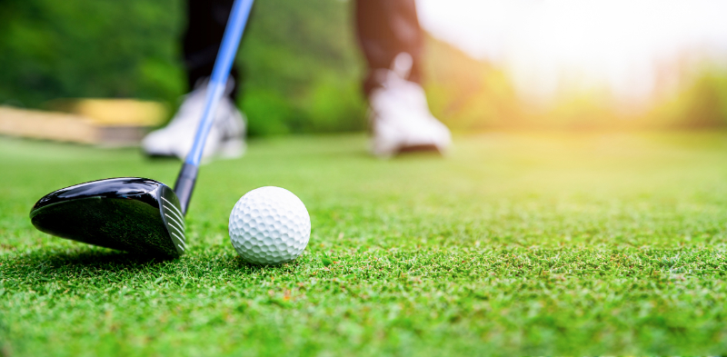 Close up golf ball on green grass